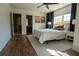 Sunlit bedroom with wood flooring and an adjacent bathroom at 3482 Willow Meadow Ln, Douglasville, GA 30135