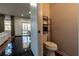Charming half-bathroom located off a bright living area, with a modern rack for towels at 3482 Willow Meadow Ln, Douglasville, GA 30135