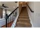 Carpeted staircase leading to the second floor, with modern black railings at 3482 Willow Meadow Ln, Douglasville, GA 30135