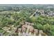 Aerial view of a suburban neighborhood with mature trees, showcasing the home's location and surrounding community at 358 Nature Brook Se Walk, Smyrna, GA 30082