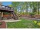 Backyard patio featuring a wooden deck and a lush lawn, great for relaxation at 358 Nature Brook Se Walk, Smyrna, GA 30082