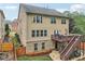 Two-story house featuring a wooden deck and a stone patio, perfect for outdoor entertaining at 358 Nature Brook Se Walk, Smyrna, GA 30082