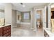 Bright bathroom featuring a soaking tub and toilet at 358 Nature Brook Se Walk, Smyrna, GA 30082