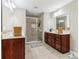Bright bathroom with tile floor, a glass shower, and double sink vanity at 358 Nature Brook Se Walk, Smyrna, GA 30082