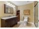 Well-maintained bathroom featuring a granite vanity, a toilet, and a glass-enclosed shower at 358 Nature Brook Se Walk, Smyrna, GA 30082