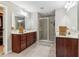 Spacious bathroom featuring double vanities, large shower with glass door and tile flooring at 358 Nature Brook Se Walk, Smyrna, GA 30082