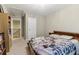Bedroom with neutral walls, light carpet, built in bookshelf storage and door to hallway at 358 Nature Brook Se Walk, Smyrna, GA 30082