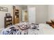 Bedroom with neutral walls, light carpet, built in bookshelf storage and door to hallway at 358 Nature Brook Se Walk, Smyrna, GA 30082