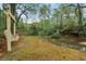 Tranquil creek and swing set in a beautiful, lush green yard that offers a serene retreat at 358 Nature Brook Se Walk, Smyrna, GA 30082