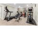 Home gym featuring a treadmill, elliptical machine, and weight bench on carpeted flooring at 358 Nature Brook Se Walk, Smyrna, GA 30082