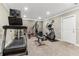 Home gym featuring a treadmill, elliptical machine, and weight bench on carpeted flooring at 358 Nature Brook Se Walk, Smyrna, GA 30082