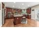 Spacious kitchen with stainless steel appliances, hardwood flooring, and a center island with countertop seating at 358 Nature Brook Se Walk, Smyrna, GA 30082