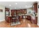 Well-appointed kitchen with stainless steel appliances, dark wood cabinetry, and a functional island with seating at 358 Nature Brook Se Walk, Smyrna, GA 30082