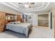 Spacious main bedroom featuring a trey ceiling, cozy carpet, and stairway access at 358 Nature Brook Se Walk, Smyrna, GA 30082