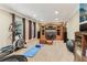 Recreation room featuring a large entertainment center, a yoga mat, and an elliptical machine at 358 Nature Brook Se Walk, Smyrna, GA 30082