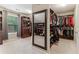 Walk-in closet with mirror and custom shelving at 358 Nature Brook Se Walk, Smyrna, GA 30082