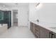 Modern bathroom with dual sinks, sleek cabinetry, and a glass-enclosed shower at 461 Maypop Ln, Woodstock, GA 30188