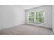 This cozy bedroom gets a lot of natural light from two large windows at 461 Maypop Ln, Woodstock, GA 30188