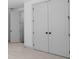 Bedroom featuring carpet flooring and white doors at 461 Maypop Ln, Woodstock, GA 30188