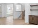 Inviting entryway with staircase and built-in shelving, providing a warm welcome at 461 Maypop Ln, Woodstock, GA 30188