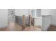 Hallway with wooden banister at 461 Maypop Ln, Woodstock, GA 30188