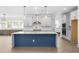 Modern kitchen with a large island, stainless steel appliances, and ample cabinet space at 461 Maypop Ln, Woodstock, GA 30188