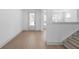 Bright living room with hardwood floors and a view of the front yard at 461 Maypop Ln, Woodstock, GA 30188