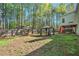 A private wooded backyard featuring a gazebo, a raised deck, and a wood fence at 2069 Willow Chase Ct, Tucker, GA 30084