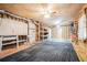 Unfinished basement with painted floors, ceiling fans, shelving, and potential for customization at 2069 Willow Chase Ct, Tucker, GA 30084
