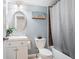 Cozy bathroom featuring an oval mirror, updated sink and fixtures, and shower-tub combination at 2069 Willow Chase Ct, Tucker, GA 30084