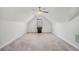 Bonus room featuring plush neutral carpet, a window, and a high vaulted ceiling at 2069 Willow Chase Ct, Tucker, GA 30084