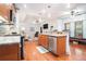 Open kitchen with stainless steel appliances and view to the living room at 2069 Willow Chase Ct, Tucker, GA 30084