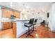 Kitchen with wood floors and cabinets, stainless appliances, with barstool seating at 2069 Willow Chase Ct, Tucker, GA 30084