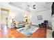 Comfortable living room with a plush sofa, fireplace, and tray ceiling at 2069 Willow Chase Ct, Tucker, GA 30084