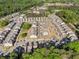Neighborhood aerial view shows a community with tree-lined streets, sidewalks, green spaces, and well-maintained homes at 3377 Park Pointe Cir, Scottdale, GA 30079
