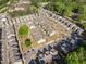 New construction homes aerial view showcases modern residences within a walkable neighborhood with green spaces and landscaping at 3377 Park Pointe Cir, Scottdale, GA 30079