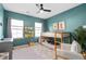 Well-lit bedroom with a bunk bed, two windows, and a neutral-colored rug at 3377 Park Pointe Cir, Scottdale, GA 30079