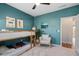 Cozy bedroom with a bunk bed and white chair, complemented by light-filled windows and green walls at 3377 Park Pointe Cir, Scottdale, GA 30079