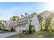 Beautiful two-story home with a two-car garage and manicured lawn, showcasing lovely curb appeal at 3377 Park Pointe Cir, Scottdale, GA 30079