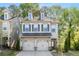 Charming two-story home featuring a two-car garage and neutral siding, with a well-maintained front yard at 3377 Park Pointe Cir, Scottdale, GA 30079