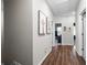Upstairs hallway featuring hardwood floors, neutral walls, and doorways to bedrooms and bathrooms at 3377 Park Pointe Cir, Scottdale, GA 30079