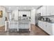 Stylish kitchen with granite countertops, stainless steel appliances, and bar seating, offering a modern look at 3377 Park Pointe Cir, Scottdale, GA 30079