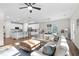 Spacious living room open to the kitchen with hardwood floors and lots of sunlight at 3377 Park Pointe Cir, Scottdale, GA 30079