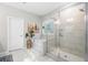 Bright bathroom featuring separate tub and walk-in shower with tiled walls and glass doors at 3377 Park Pointe Cir, Scottdale, GA 30079