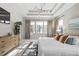 Bright main bedroom features neutral walls, a large window, hardwood dresser, and plush carpet at 3377 Park Pointe Cir, Scottdale, GA 30079