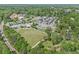 Aerial view showcasing the community's green spaces and neighborhood layout at 504 Baltimore Sw Ave, Lilburn, GA 30047