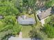Aerial view of a home with a large, tree-lined backyard, showcasing the property's layout and surrounding landscape at 504 Baltimore Sw Ave, Lilburn, GA 30047
