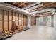 Unfinished basement with exposed beams, concrete floor, and a small window at 504 Baltimore Sw Ave, Lilburn, GA 30047