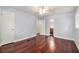 Bedroom with wood floors, ceiling fan, and ensuite bathroom at 504 Baltimore Sw Ave, Lilburn, GA 30047