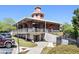 Community clubhouse boasts a clock tower and outdoor seating area for residents at 504 Baltimore Sw Ave, Lilburn, GA 30047